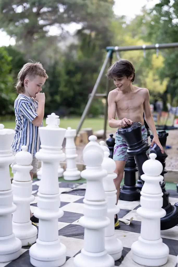 kids play large chess